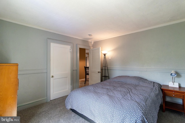 carpeted bedroom with ornamental molding