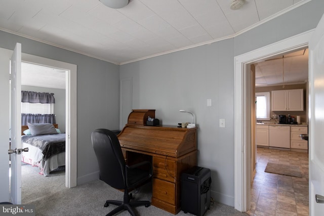 office with crown molding and baseboards