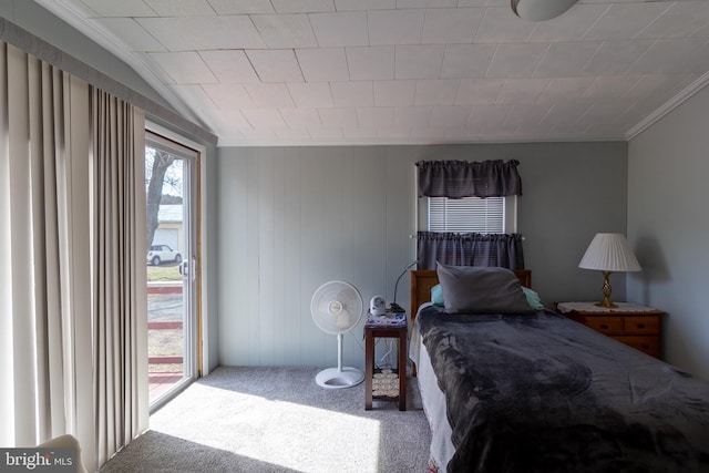 carpeted bedroom with access to exterior and ornamental molding