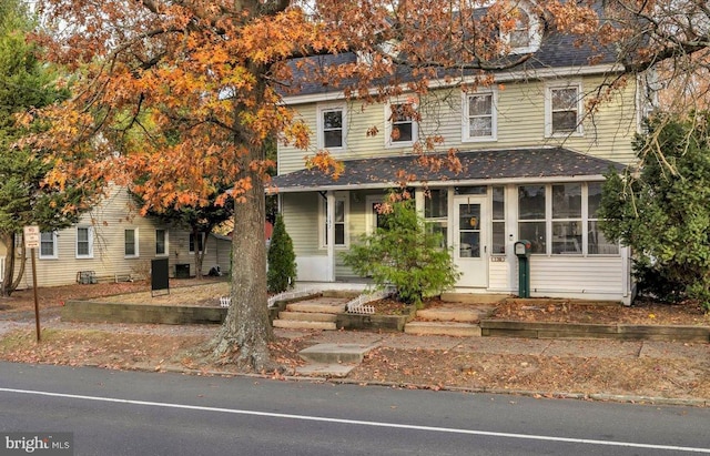 view of front of property with a shingled roof