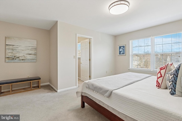 bedroom with carpet flooring and baseboards