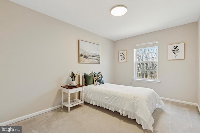 carpeted bedroom with baseboards