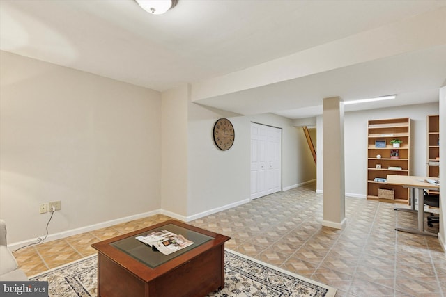 living room featuring baseboards