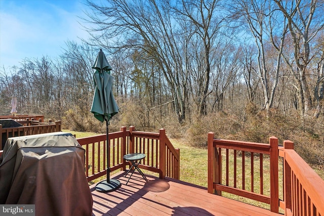 wooden deck featuring area for grilling