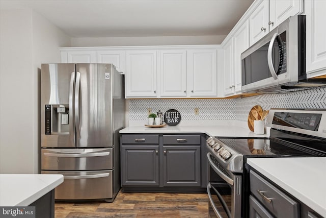 kitchen featuring white cabinetry, dark wood-style flooring, appliances with stainless steel finishes, and gray cabinetry