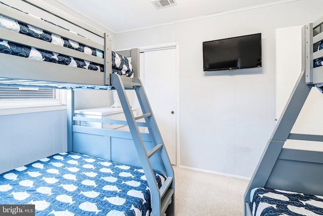 bedroom with visible vents and crown molding