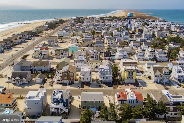 drone / aerial view featuring a view of the beach and a water view