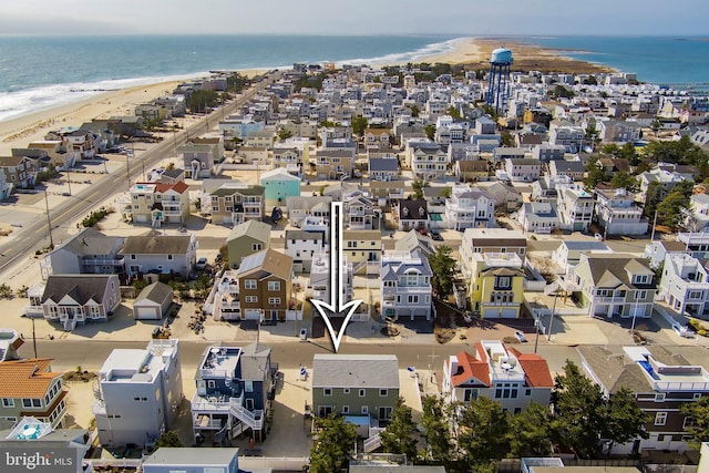 bird's eye view featuring a view of the beach and a water view