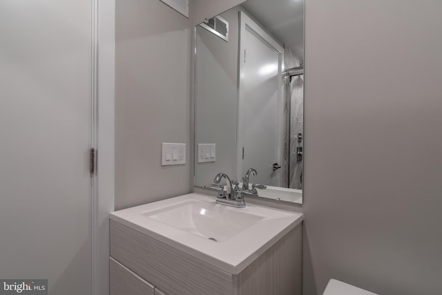 bathroom with vanity and visible vents