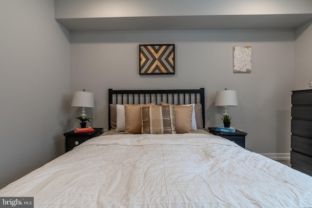 bedroom featuring baseboards