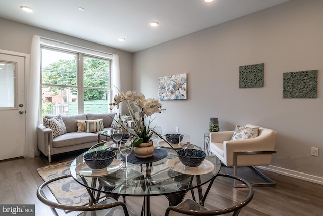 dining area with recessed lighting, baseboards, and wood finished floors