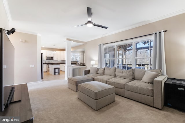 living room featuring ceiling fan, light carpet, ornamental molding, and ornate columns