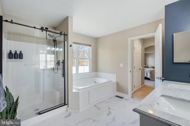 full bath with a bath, marble finish floor, a shower stall, and a sink