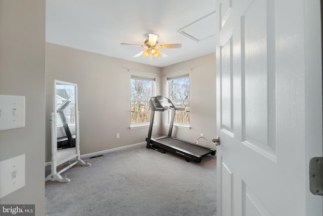 exercise area featuring visible vents, carpet floors, baseboards, and a ceiling fan