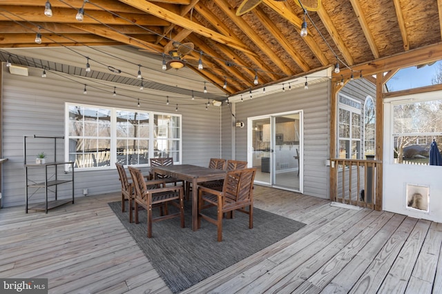 wooden terrace with outdoor dining space