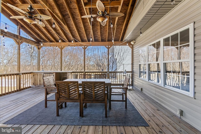 wooden terrace featuring a ceiling fan