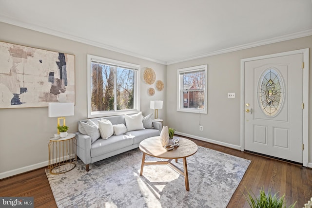 living room featuring dark wood-style floors, baseboards, and ornamental molding