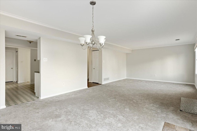 carpeted empty room featuring visible vents, baseboards, an inviting chandelier, and ornamental molding