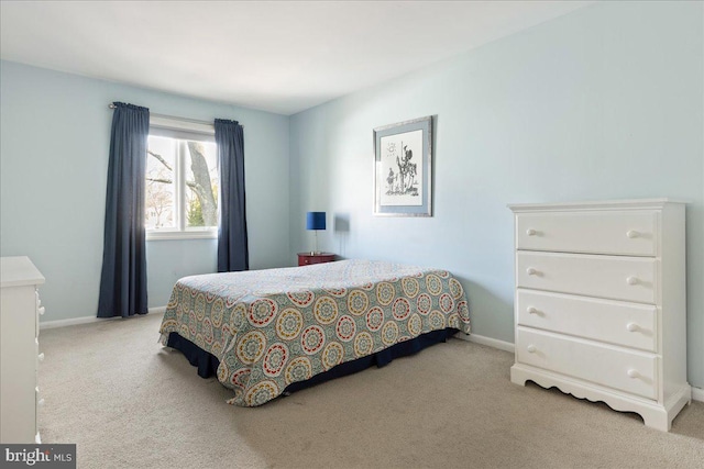 carpeted bedroom with baseboards