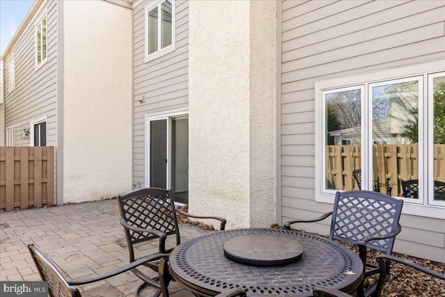 view of patio / terrace featuring outdoor dining space and fence