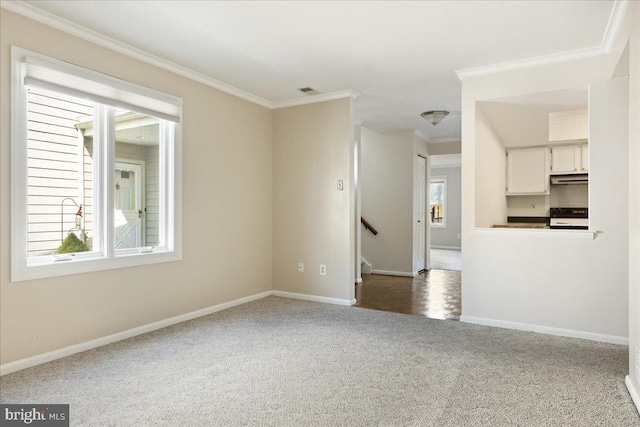 unfurnished living room featuring carpet, baseboards, and ornamental molding