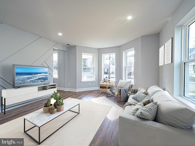 living room featuring visible vents, recessed lighting, wood finished floors, and baseboards