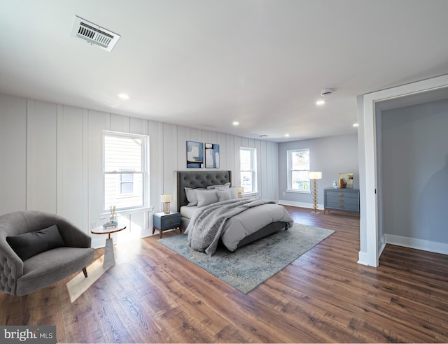 bedroom featuring recessed lighting, baseboards, visible vents, and dark wood-style flooring