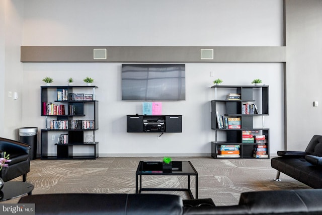 living area featuring visible vents and baseboards