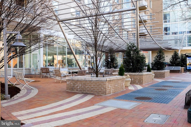 view of home's community with a patio area