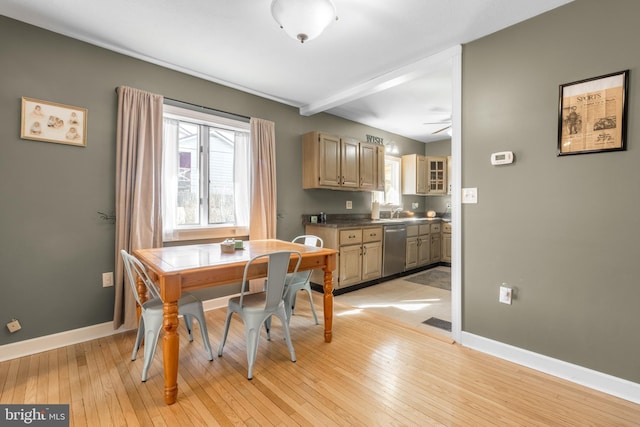 dining area with visible vents, baseboards, light wood finished floors, and ceiling fan