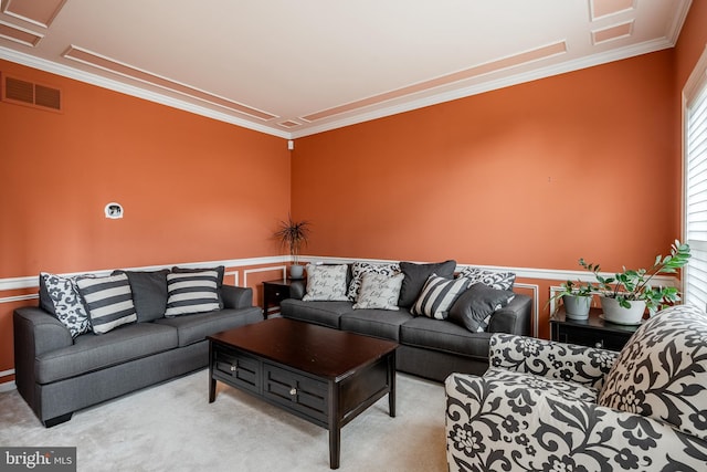 carpeted living room featuring crown molding and visible vents