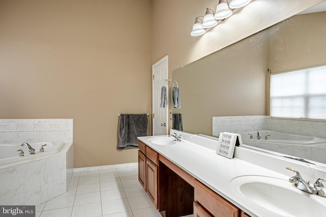 bathroom with tile patterned flooring, double vanity, a garden tub, and a sink