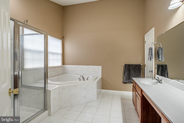 full bathroom featuring tile patterned flooring, a shower stall, vanity, and a bath