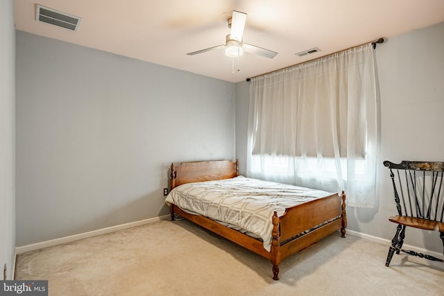 bedroom featuring visible vents, baseboards, and carpet