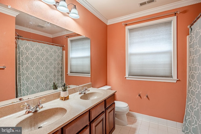 bathroom with ornamental molding, visible vents, and a sink