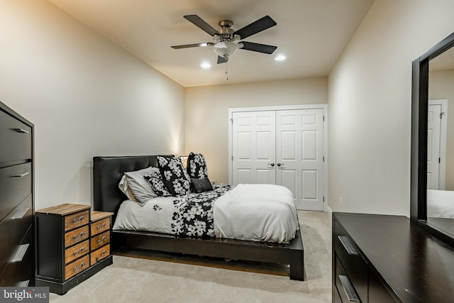 bedroom with recessed lighting, a closet, light carpet, and ceiling fan