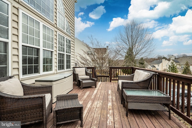 wooden deck featuring an outdoor living space