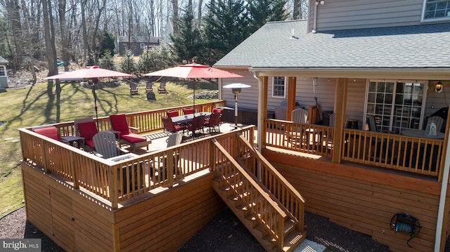 wooden terrace with outdoor dining area