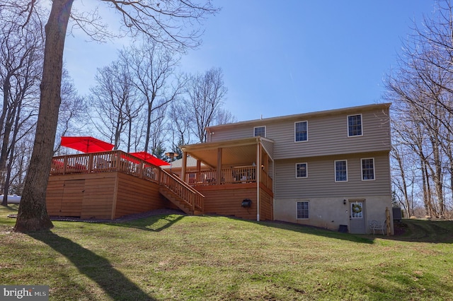 back of house featuring a yard, central air condition unit, a wooden deck, and stairs