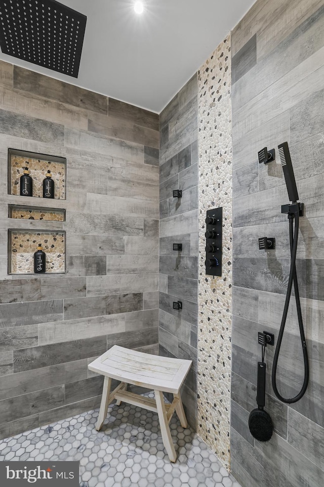 bathroom with tiled shower