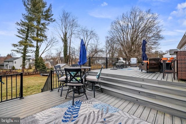 wooden terrace with a yard