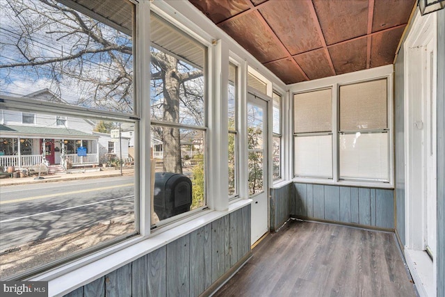 unfurnished sunroom with wooden ceiling