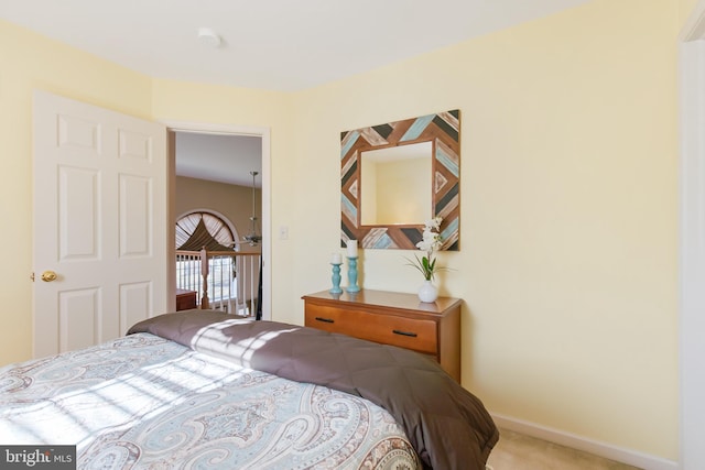 carpeted bedroom with baseboards