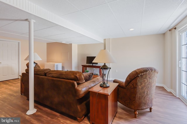 living room featuring baseboards and wood finished floors