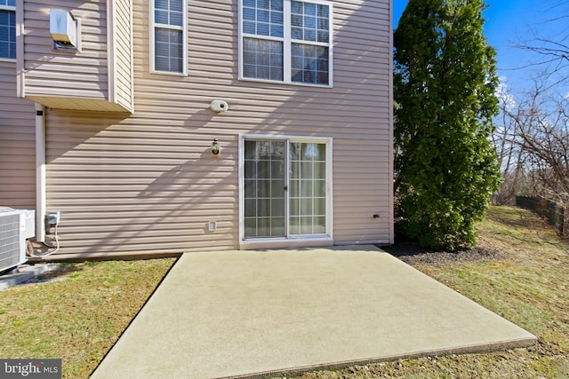 back of property with a patio area and cooling unit