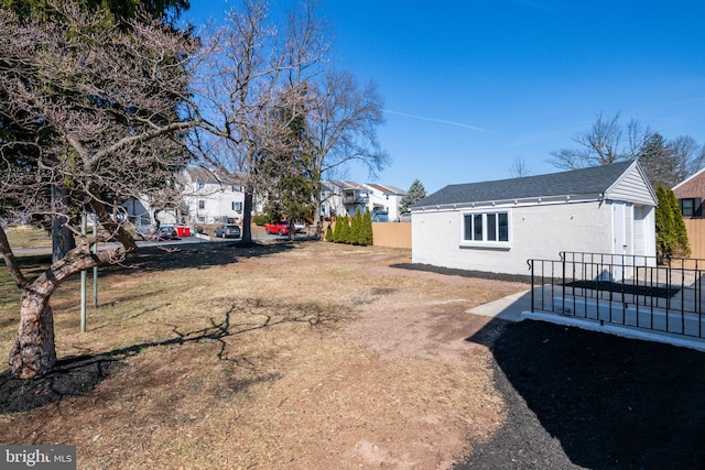 view of yard with a residential view and fence