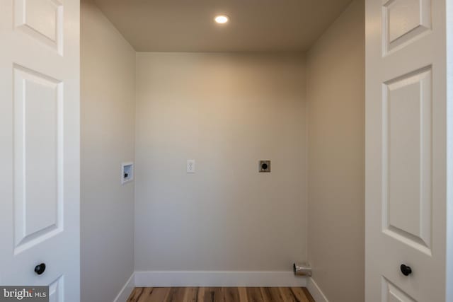 clothes washing area featuring baseboards, washer hookup, recessed lighting, wood finished floors, and electric dryer hookup