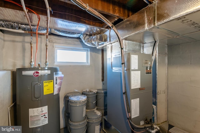 utility room featuring heating unit and water heater