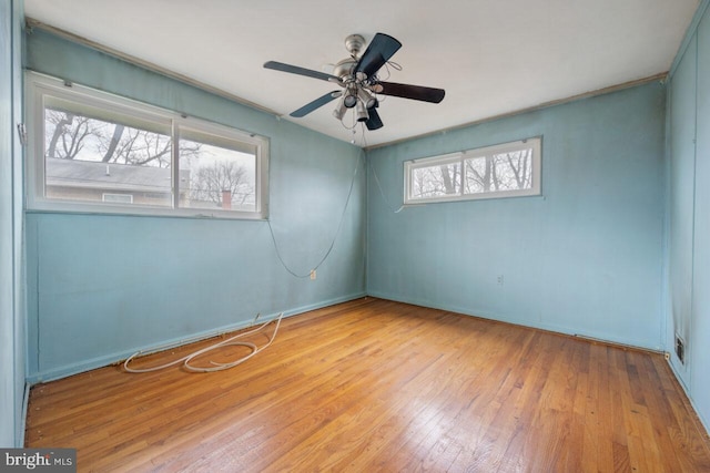 empty room featuring ceiling fan and wood-type flooring