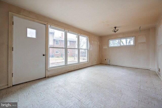 interior space with tile patterned floors and plenty of natural light